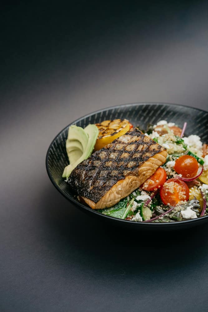 A seared fillet of sea bass, plated